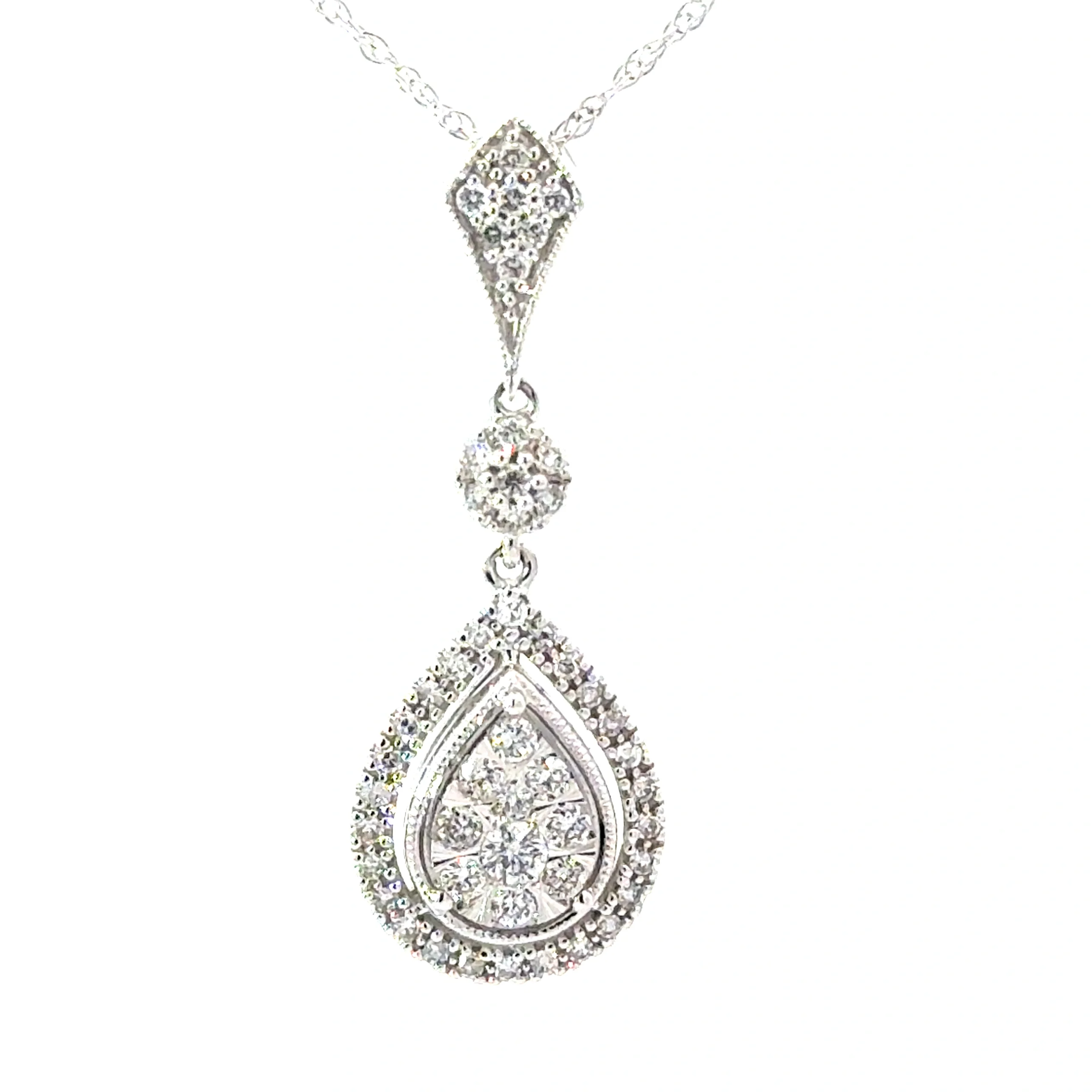 Elegant 14kt white gold pendant with a 0.50cts SI, H color pear-shaped diamond, gracefully suspended from an 18" chain.