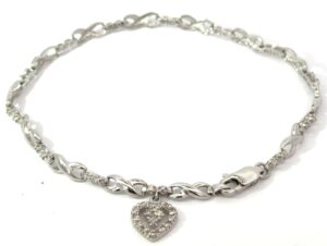 10kt white gold diamond tennis bracelet with dangle heart tw 0.11cts SI3/I1 clarity, near colorless I/J color