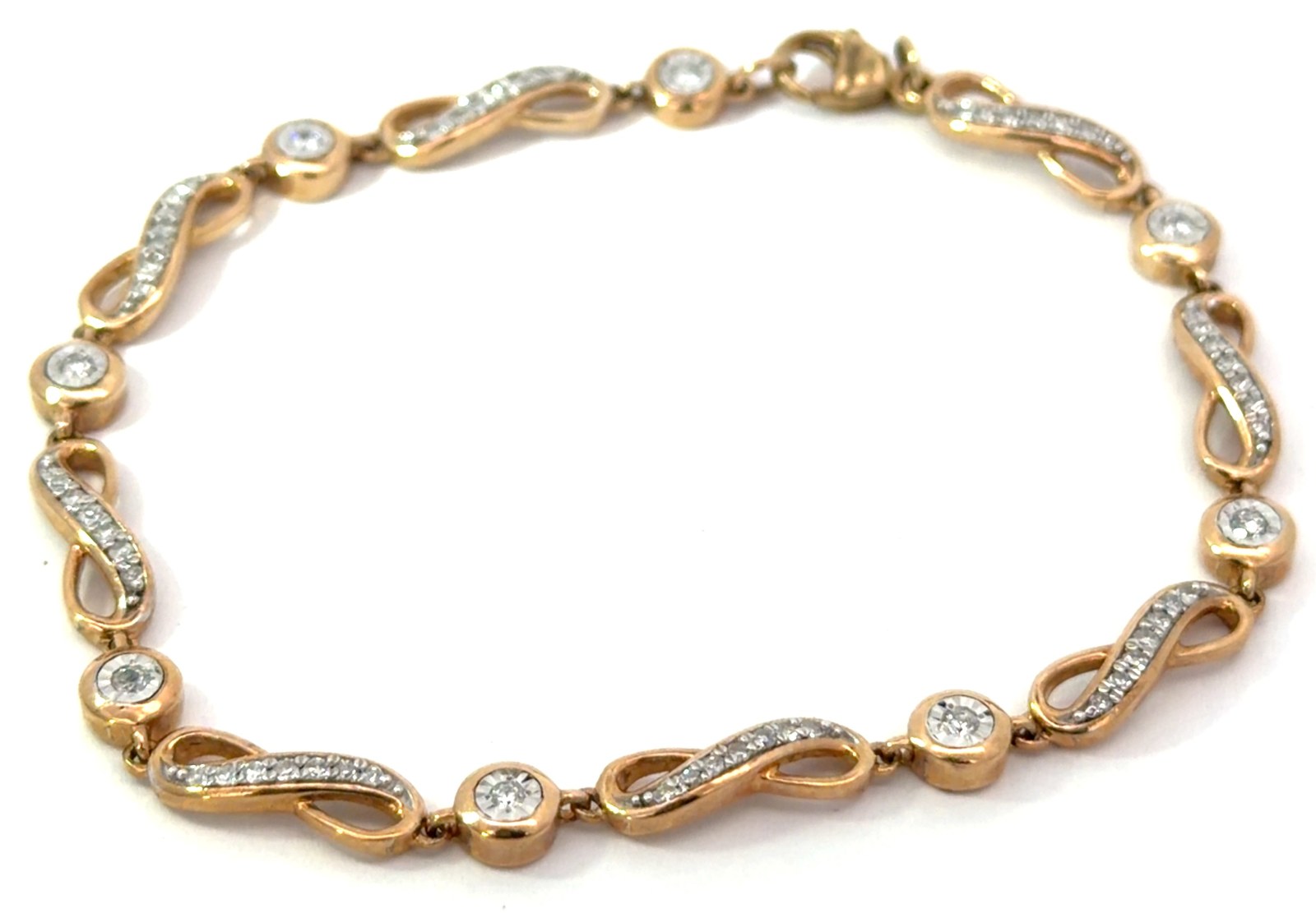.jpg 10kt two tone diamond infinity illusion bracelet with claw catch tw 0.50cts SI, near colorless H/I