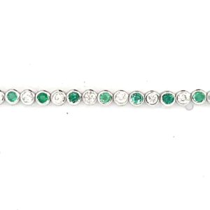 10kt white gold diamond and genuine emerald tennis bracelet D tw 0.95cts, E tw 0.95cts SI2 clarity, near colorless H colorless