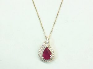 14kt yellow gold diamond and ruby pendant D tw 0.19cts SI, H R tw 0.90cts 18"