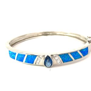 Sterling Silver rhodium plated created blue opal inlay and cz bangle bracelet with foldover safty