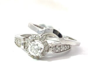 14kt w/g dia eng ring halo set with match plain band. 24 rd dia C. 5.00mm, SI1, H color, TW 0.83 cts