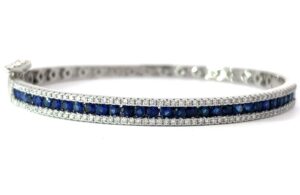 14kt white gold diamond and sapphire channel set bangle bracelet D tw 0.72cts S tw 2.00cts SI clarity, near colorless H/I color