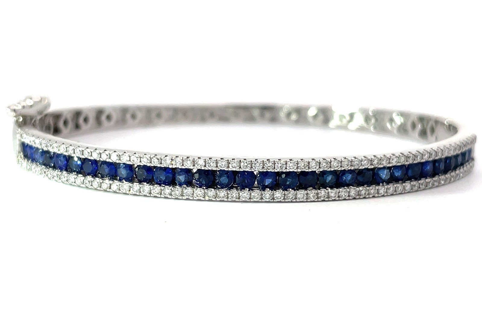 wg .jpg 14kt white gold diamond and sapphire channel set bangle bracelet D tw 0.72cts S tw 2.00cts SI clarity, near colorless H/I color