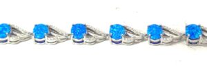 Sterling Silver rhodium plated created blue opal inlay and cubic zirconia fashion bracelet 7"