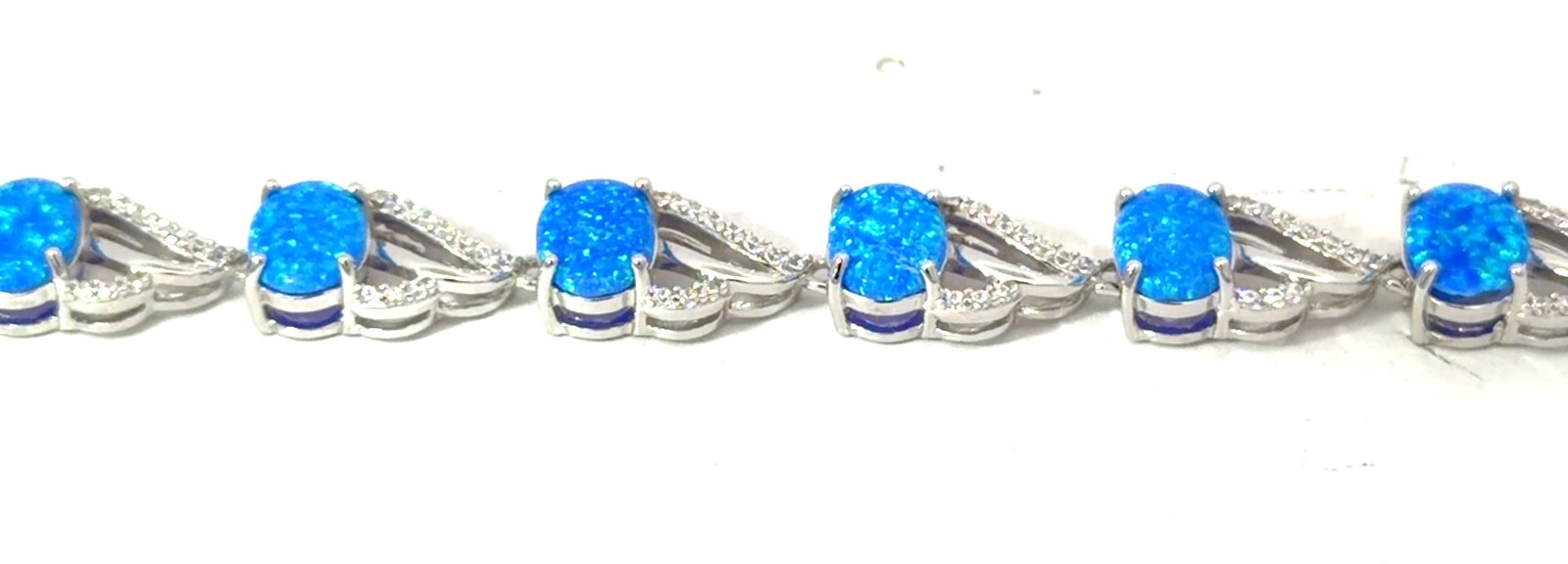 Sterling Silver rhodium plated created blue opal inlay and cubic zirconia fashion bracelet 7"