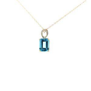 10kt yellow gold diamond and emerald cut blue topaz pendant D tw 0.04cts SI clarity, near colorless I color on machine made rope 18"