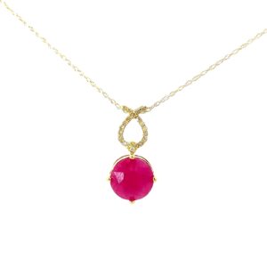 10kt yellow gold ruby and diamond pendant D tw 0.10cts I1 clarity, J color on 18" machine made chain