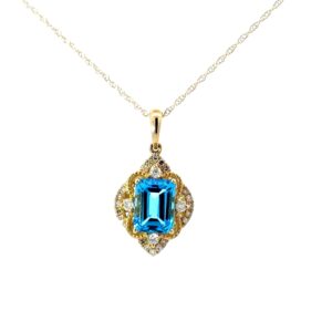 10kt yellow gold blue topaz and diamond antique style pendant D tw 0.15cts SI clarity, near colorless H color on machine made rope chain 18"