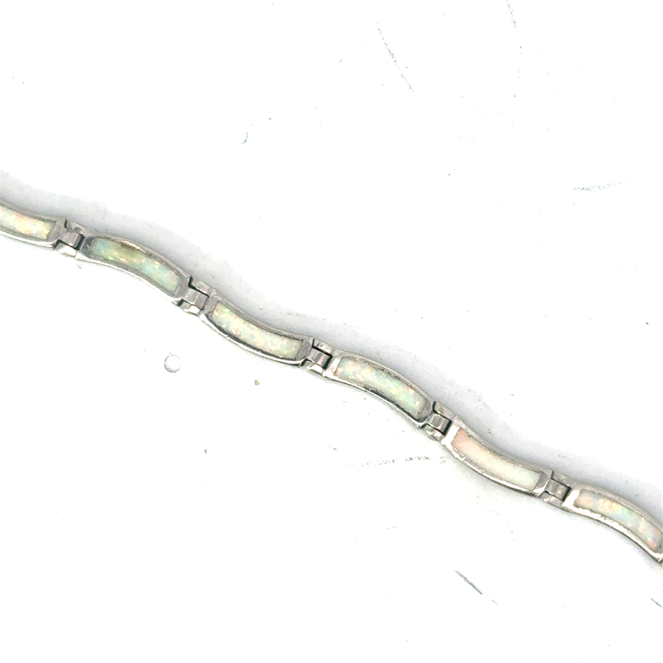 c scaled .jpg Sterling Silver rhodium plated created white opal inlay wave bracele with claw catch closure