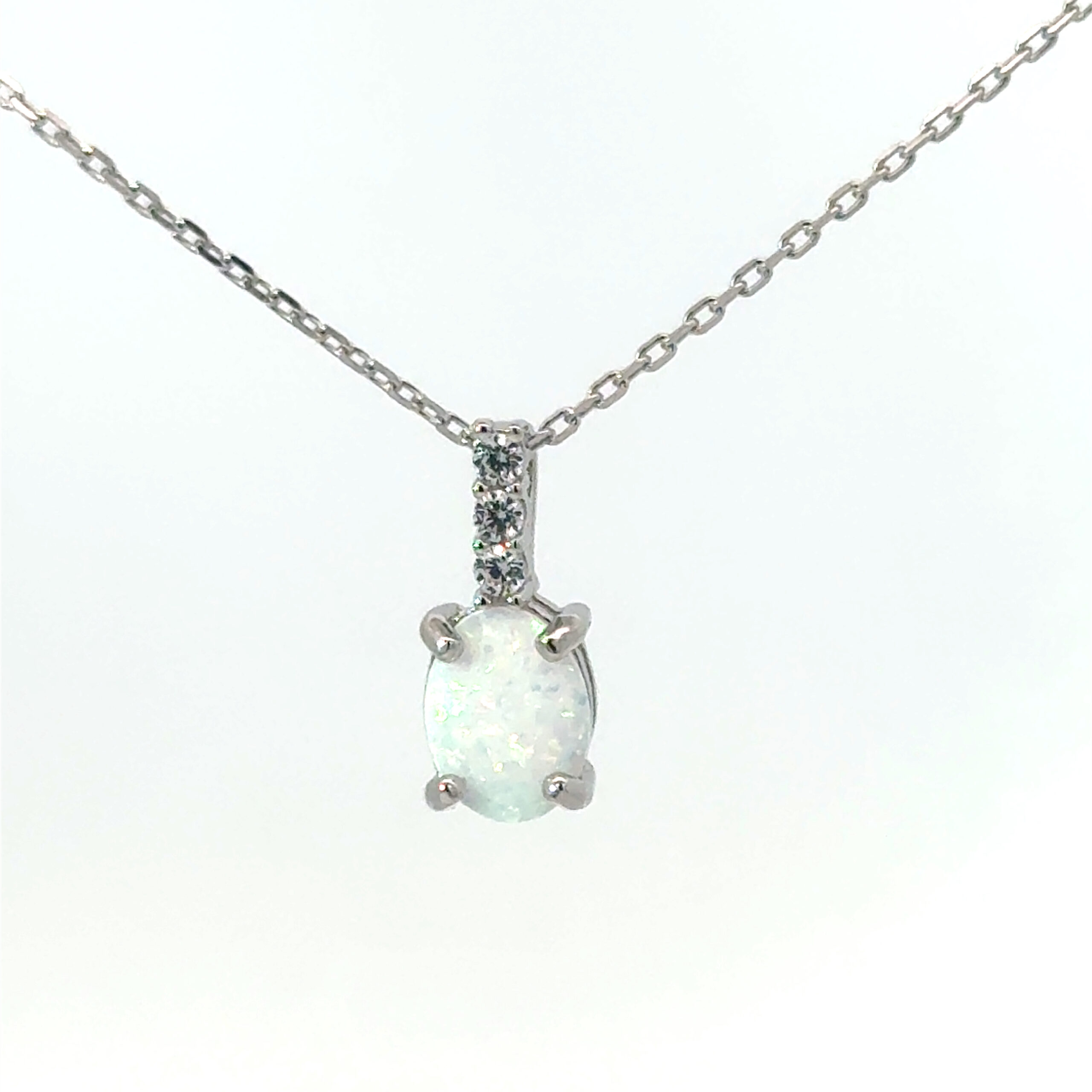 eed scaled .jpg Sterling Silver rhodium plated created white oval opal and cubic zirconia on 1.2mm cable chain 18"