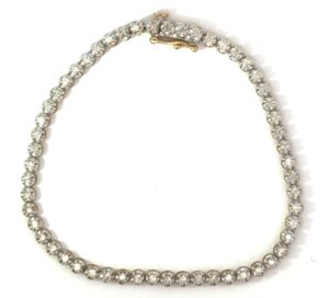 10kt two tone diamond tennis bracelet D tw 1.05cts SI2, I with safety on side