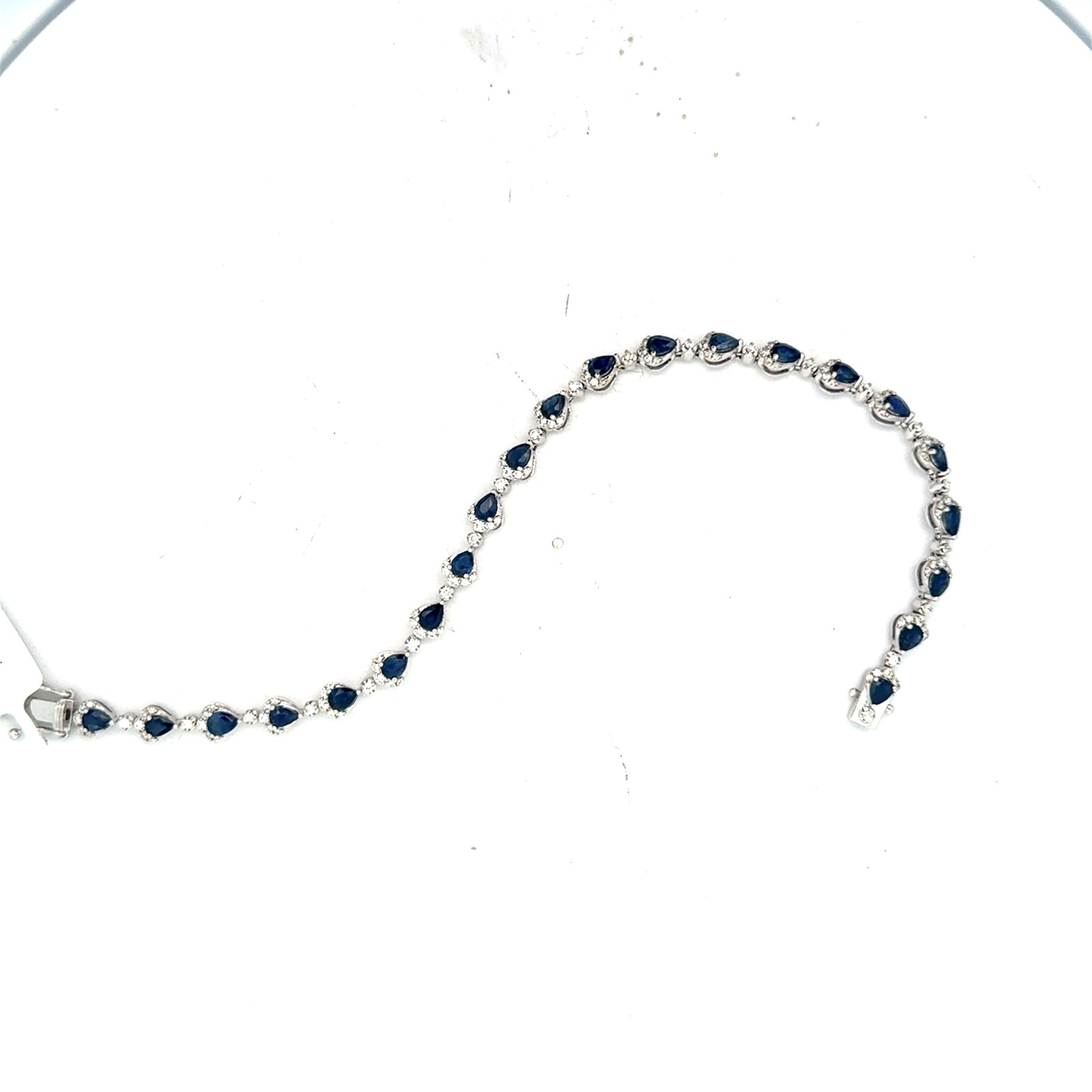 14kt white gold pear shape sappire tw 7.00cts and diamond tw 2.00cts SI1 clarity, near colorless G/H color bracelet