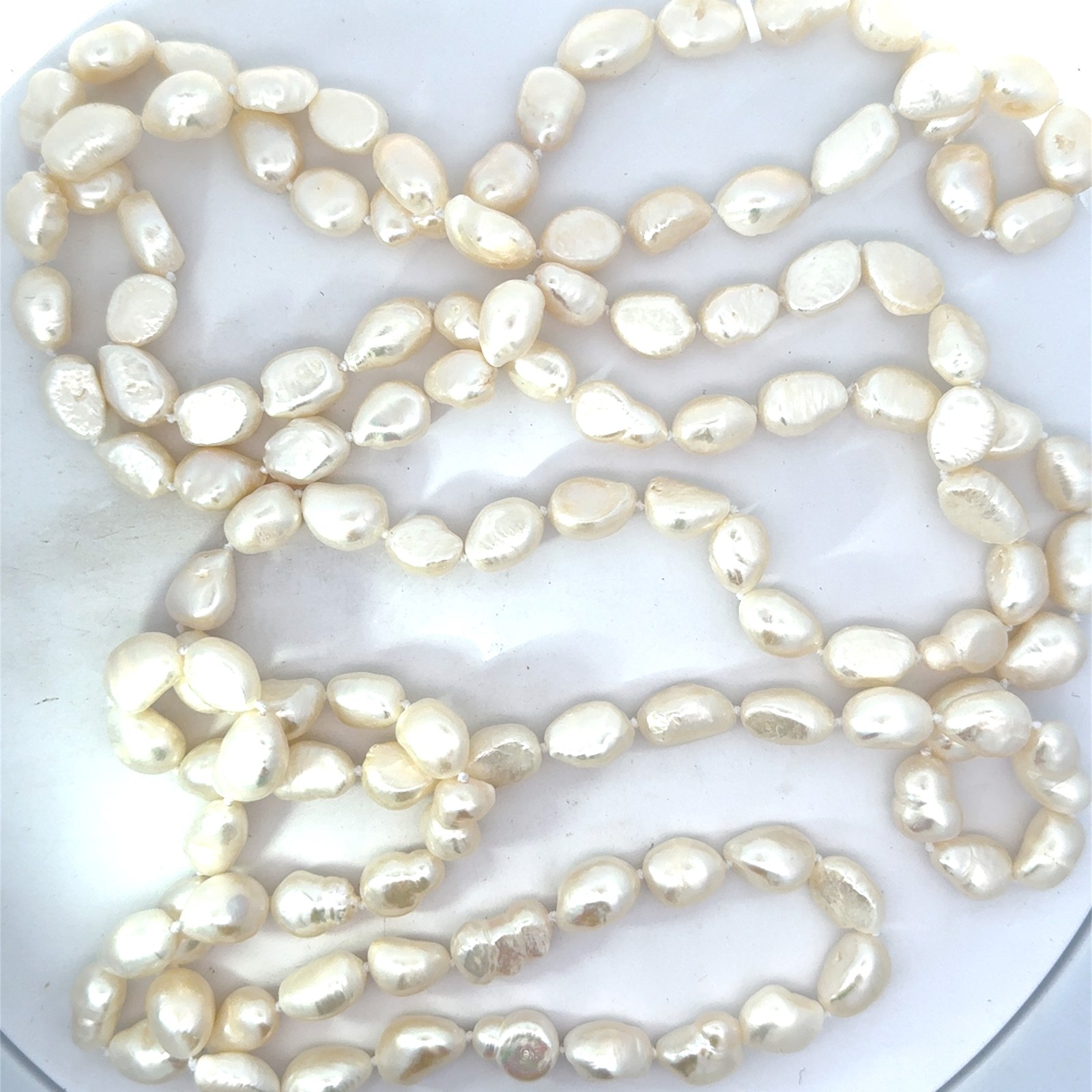.jpg Baroque pearl continuous white strand necklace 64" long 9 by 11mmm