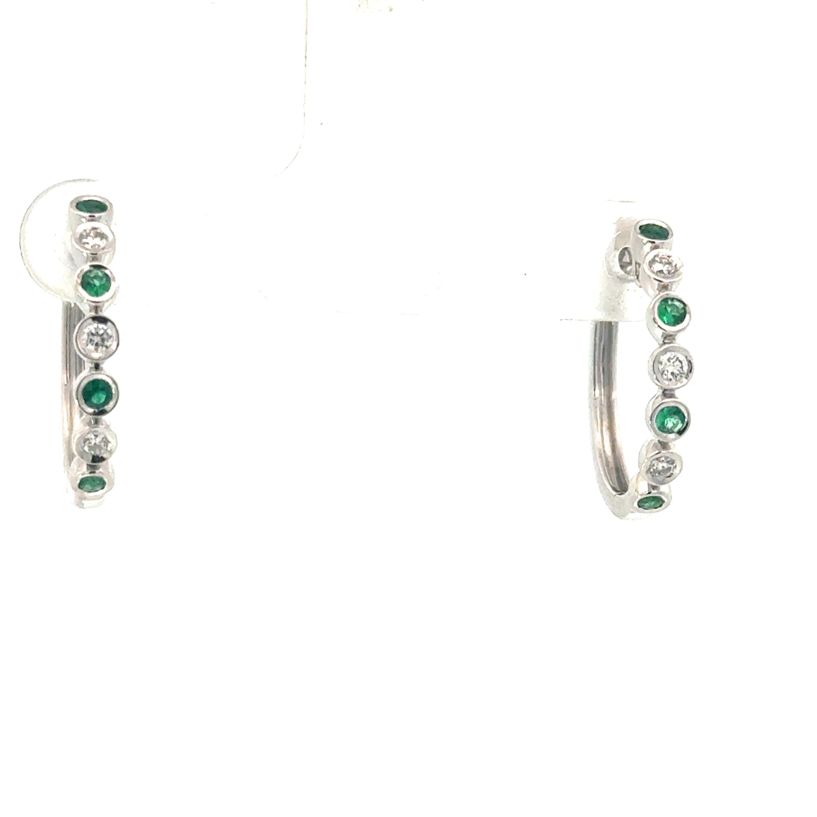 .jpg 14kt white gold diamond and emerald bezel set huggie hoop earring E tw 1/5ct D tw 1/6ct VS2 clarity, near colorless G color