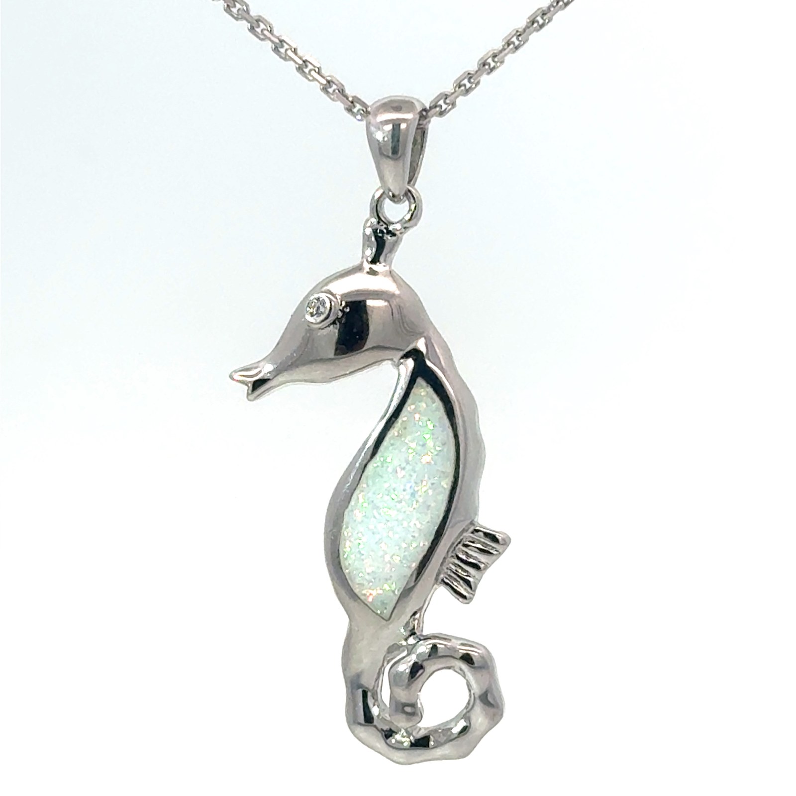 Sterling Silver rhodium plated created white opal inlay seahorse pendant on 1.4mm diamond cut cable chain 18"
