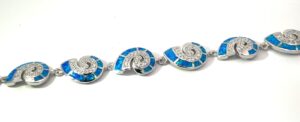 Sterling Silver cubic zirconia and created blue opal inlay shell bracelet