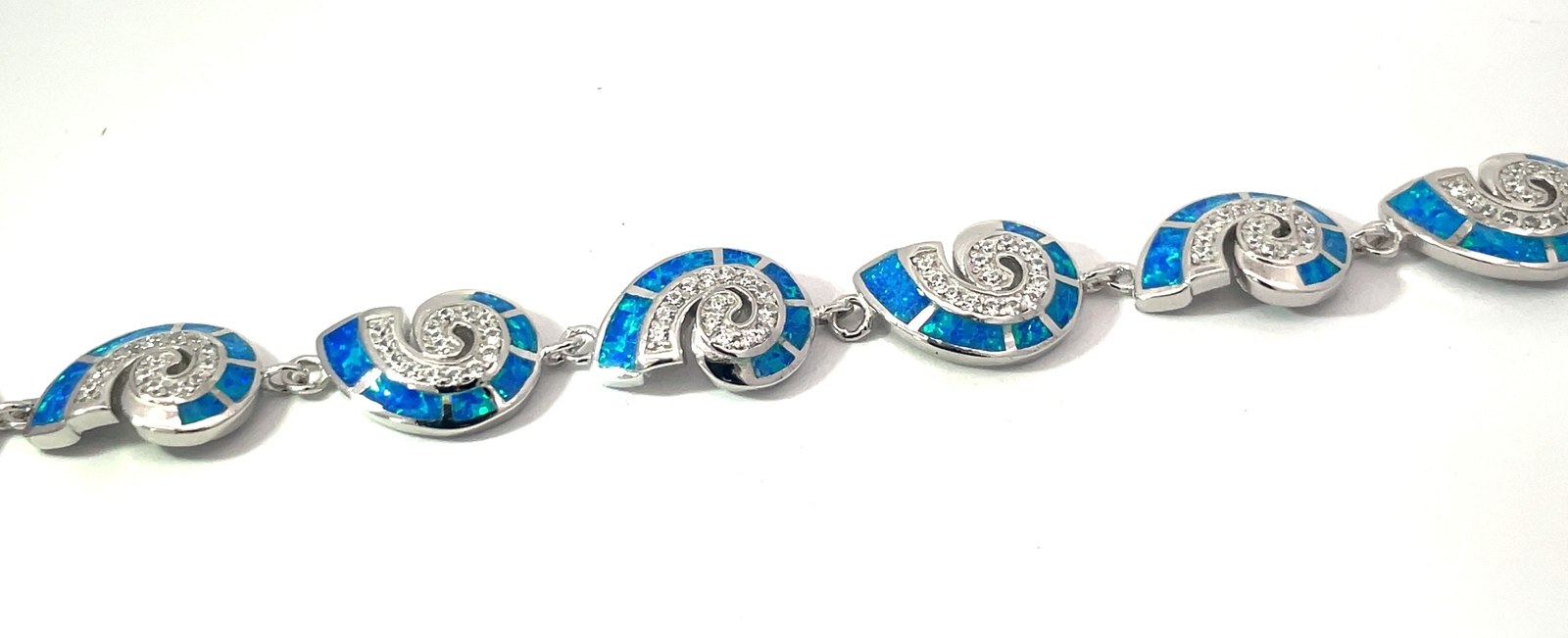 .jpg Sterling Silver cubic zirconia and created blue opal inlay shell bracelet