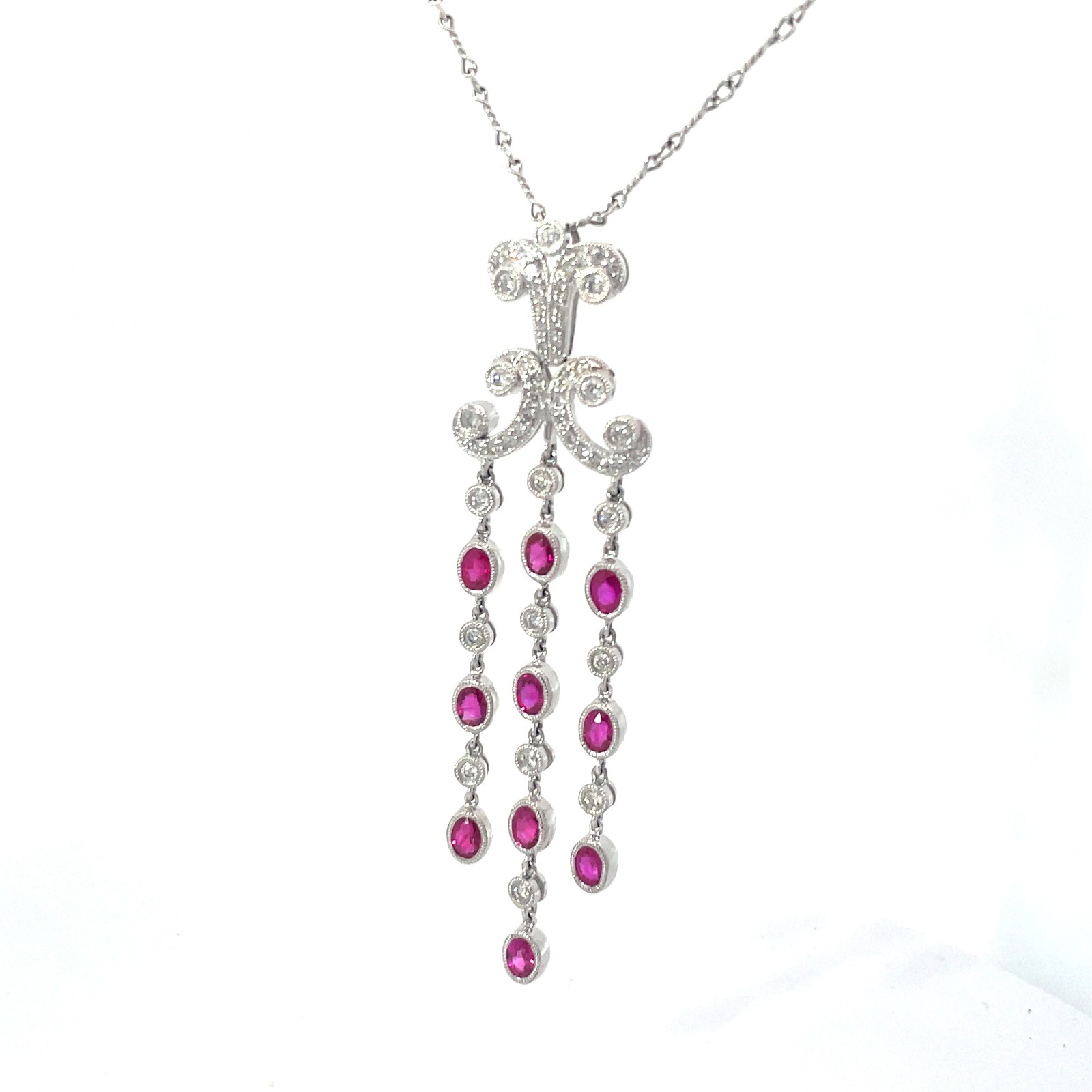 18kt wg ruby and diamond necklace 10- 4x3 genuine rubies 2.34ct, 0.60 pts 51 round diamonds