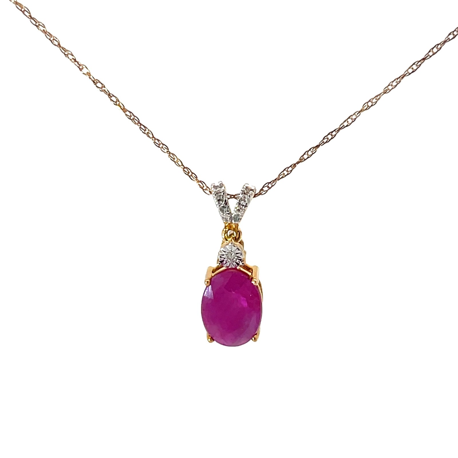 10kt yellow gold oval gen ruby and diamond pendant D tw 0.05cts SI2, I color on machine made rope 18"
