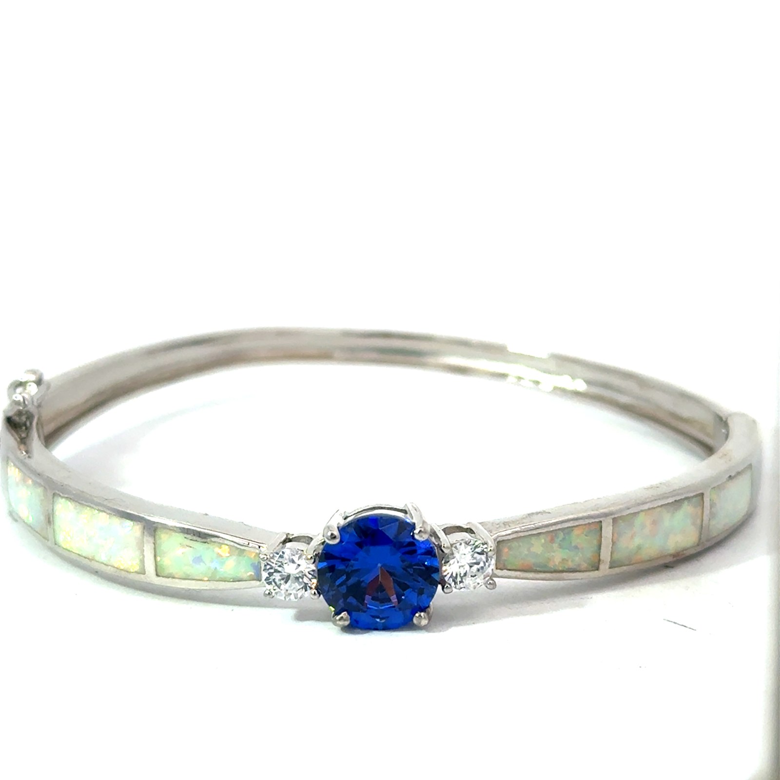 Sterling Silver rhodium plated created white opal inlay with tanzanite color cz center bangle bracelet