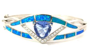 Sterling Silver rhodium plated created blue opal inlay with cz center