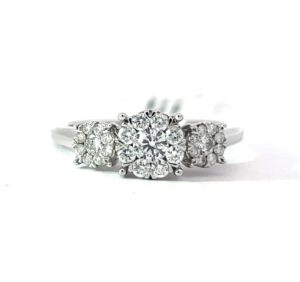 14kt white gold diamond halo three stone ring tw 1/5ct SI1, near colorless H
