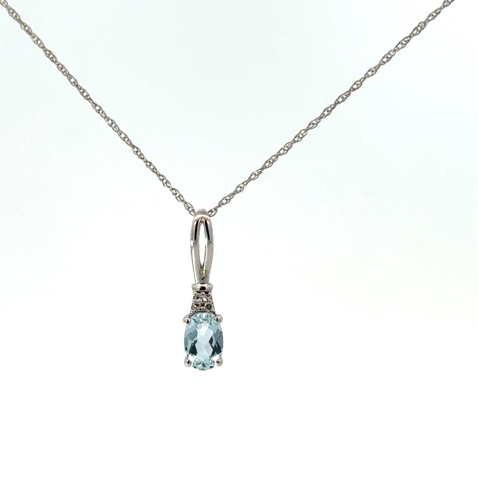 14kt white gold genuine aquamarine and diamond pendant A tw 0.30cts D tw 0.02cts SI clarity, near colorless I color on 18" machine made rope