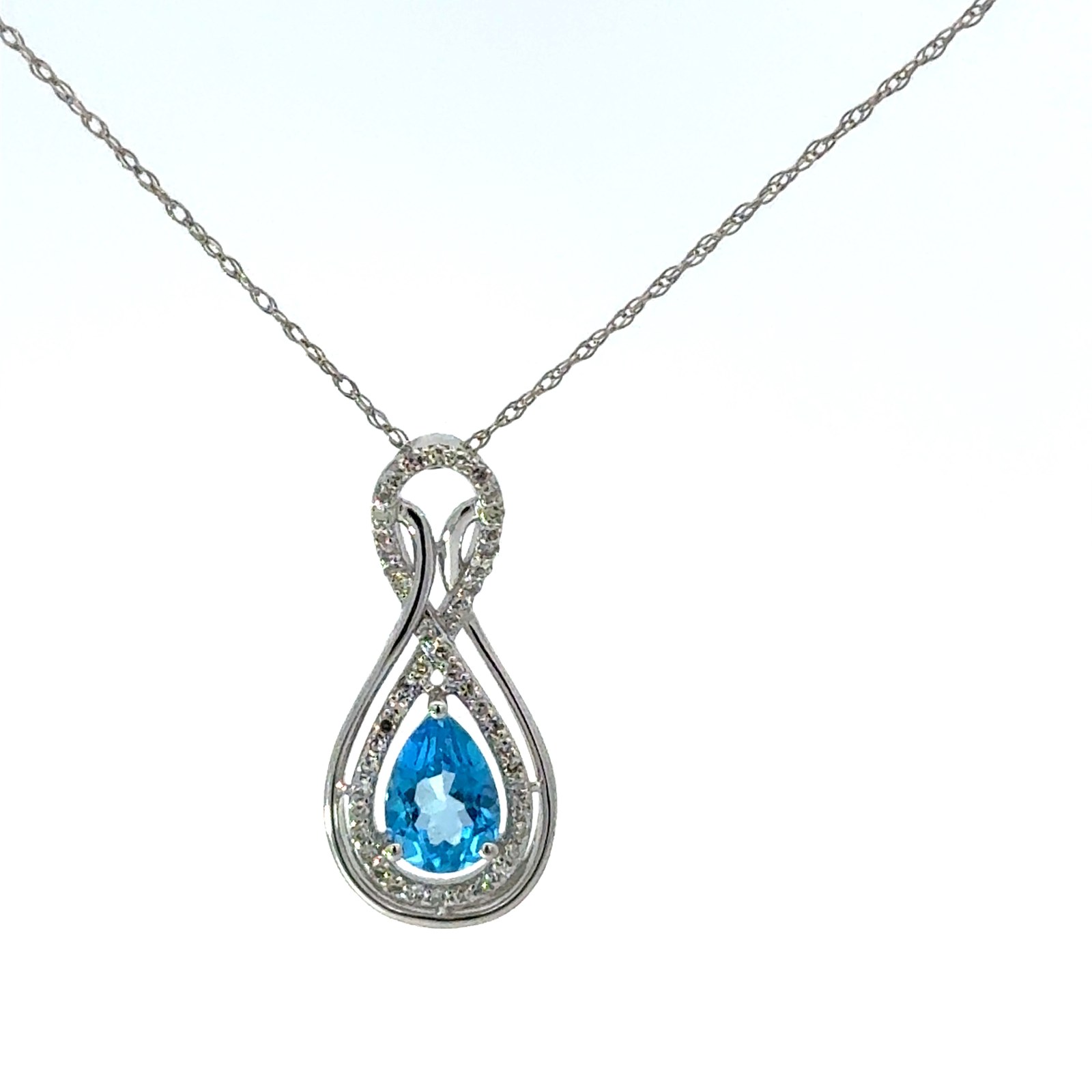 14kt white gold diamond and genuine blue topaz pear shape halo pendant BT tw 0.75cts D tw 0.17cts SI, I color