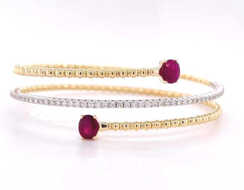 BCV RU .jpg 14kt yellow gold diamond and ruby flexible bypass bracelet R tw 1.38cts D tw 0.57cts