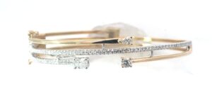 14kt two tone diamond bypass bangle bracelet D tw 1.11cts SI clarity, near colorless H color with two foldover safties