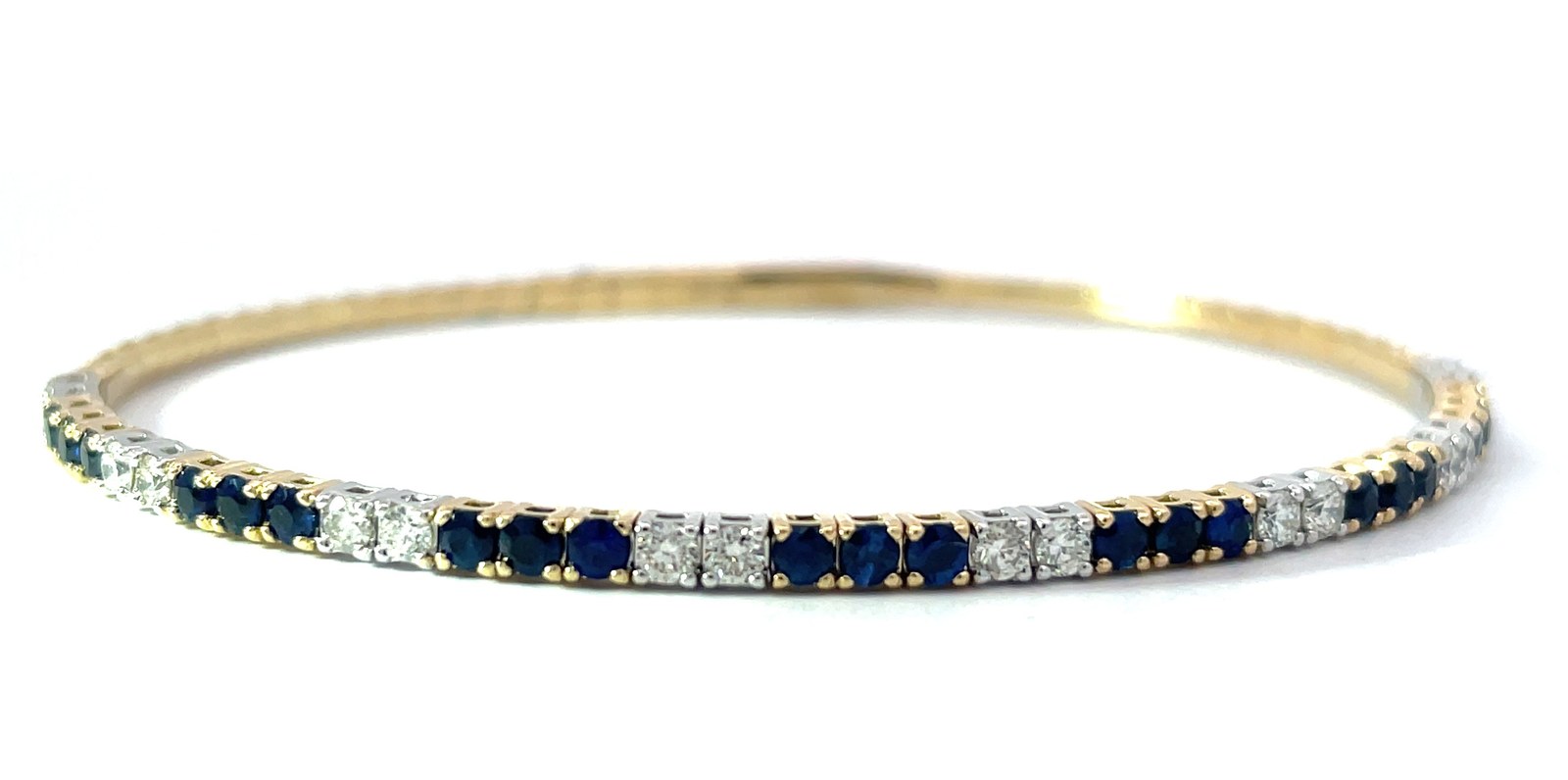 BDD Sap .jpg 14kt two tone diamond and genuine sapphire flex bangle bracelet D tw 0.65ct S tw 1.21cts VS2/SI1 clarity, near colorless H color