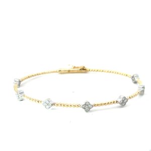 14kt two tone round brilliant diamond clover bangle bracelet D tw 0.42cts SI clarity, near colorless H color with foldover safety