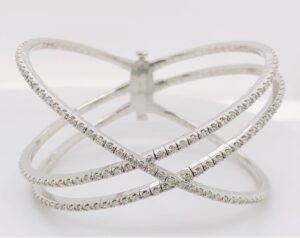 14kt white gold diamond double cross over fashion flexible bangle D tw 2.46cts SI, I with push locks