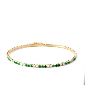 14kt y/g genuine emerald and diamond flex bangle bracelet D tw 0.43cts SI clarity, near colorless H E tw 0.67cts with foldover safety