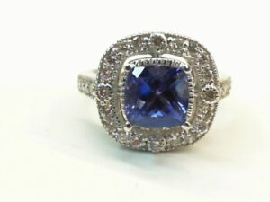 14kt white gold tanzanite and diamond halo ring with milgrain edge D tw 0.68cts VS2. G