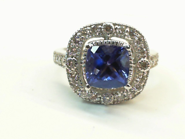 D A 14kt white gold tanzanite and diamond halo ring with milgrain edge D tw 0.68cts VS2. G
