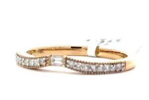 14kt yellow gold diamond curved band with one baguette tw 0.13 cts SI2, H milgrain edge
