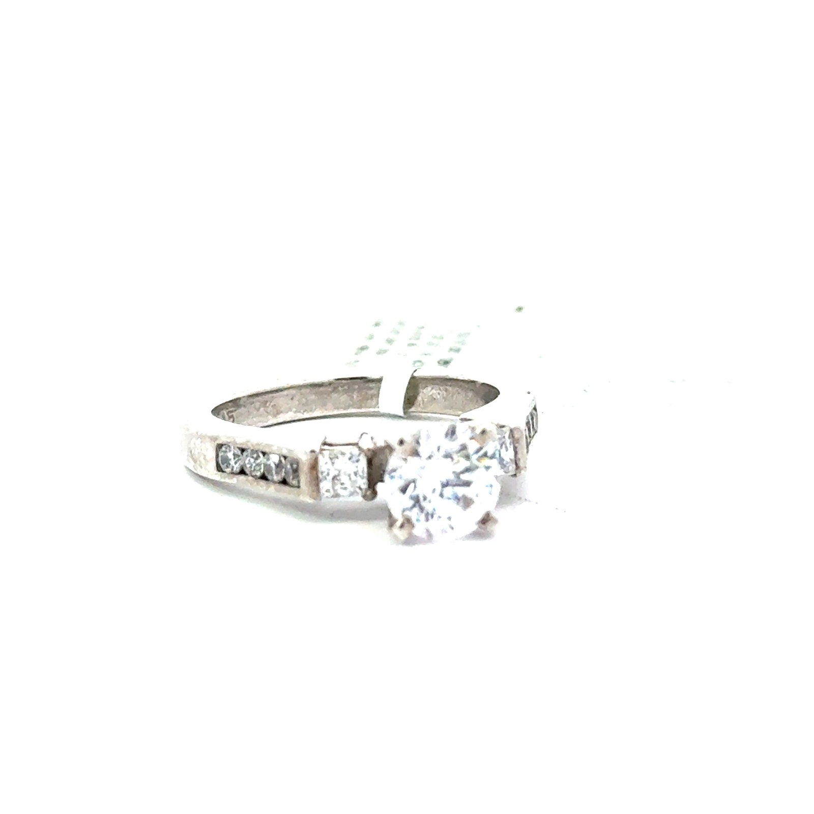 MU .jpg S.S. round cz center with 2 cz princess cut sides and 4 rd cz channel set down sides. cz center 1.00 ct