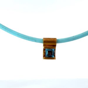 14KT Y/G BLUE TOPAZ SQUARE PENDANT ON BLUE CORD