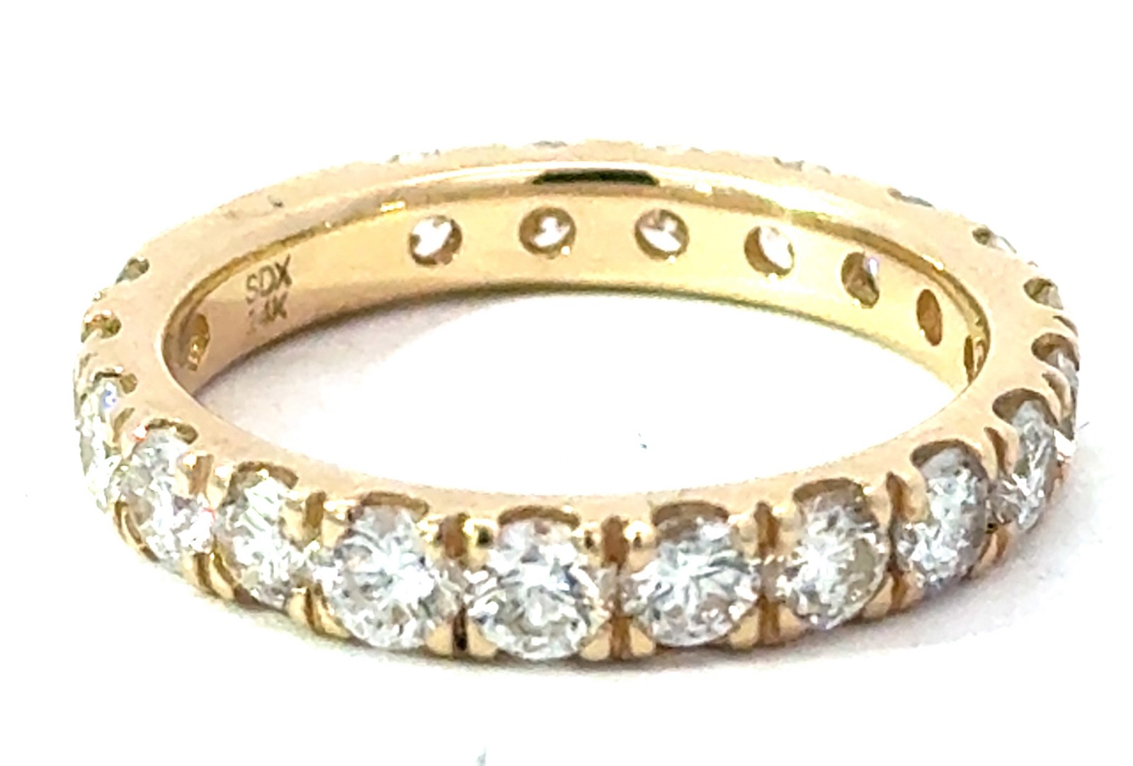14kt yellow gold classic diamond wedding band with a small sizing bar in back tw 2.10cts SI clarity, near colorless H color