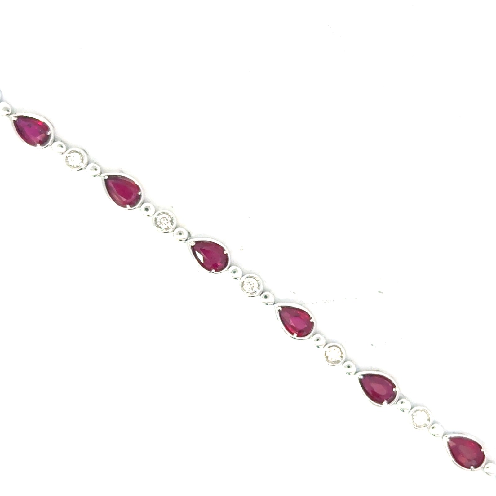 TCP Ruby .jpg 14kt w/g diamond and pear shaped ruby bracelet D tw 0.40cts SI1 clarity, near coloress G/H R tw 2.50cts with two foldover safety