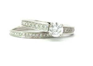 14k w/g bridal set 23 rd in band 16 rd side in eng ring, center 0.47 pts tw for all 0.83 pts SI3, H