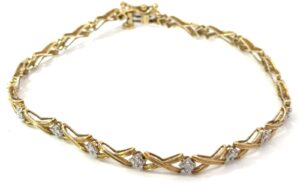 10kt yellow gold diamond X tennis bracelet tw 0.20cts SI3/I1 clarity, near colorless I color with foldover safety