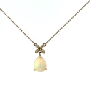 10kt yellow gold fashion diamond and genuine opal pendant D tw 0.17cts on machine made rope with spring ring clasp