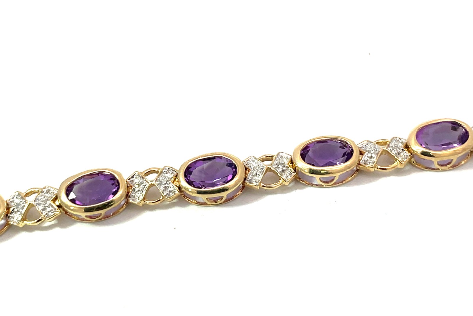 XTDA .jpg 14kt two tone diamond and amethyst fashion oval bracelet A tw 2.90cts D tw 0.13cts SI clarity, H color with foldover safety