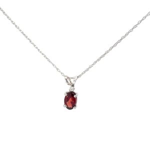 10kt white gold diamond and oval garnet pendant on machine rope 18" tw 0.01