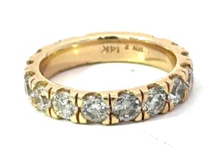 14kt yellow gold classic diamond wedding band with a sizing bar in back tw 2.75cts SI clarity, near colorless H