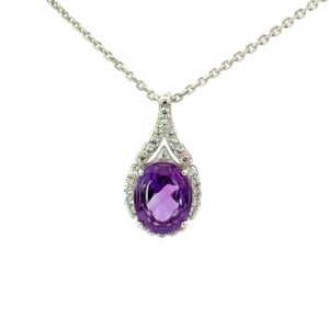 Sterling Silver rhodium plated natural amethyst and cubic zirconia oval fashion halo pendant on 1.4mm diamond cut cable chain 18"